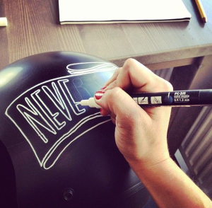 pinstriping and writing with pens on custom helmets