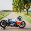 BMW sprint racing motorcycle on a country lane