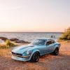 Datsun 240Z on a beach at sunset in Southern Japan