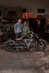 The Brat-Style Indian Super Chief Limited tricked out for actor Nicolas Hoult, modded out by Brat-Style founder Gō Takamine: side view with Hoult and Takamine