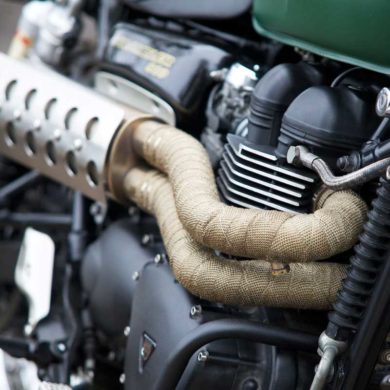 Exhaust pipes with pipe wrap on a Triumph Scrambler Motorcycle