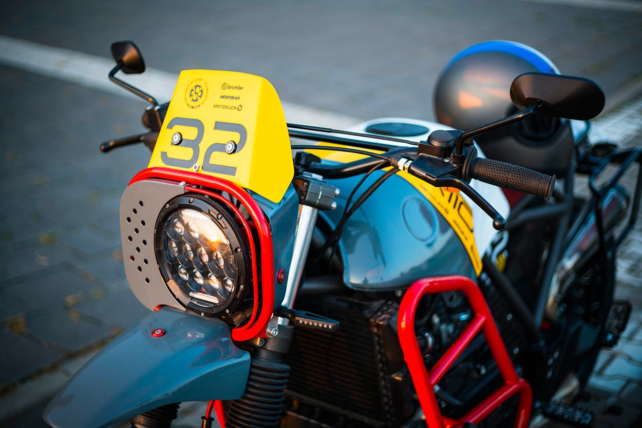 A cool racing number board on a BMW off road racer by Cardsharper Customs