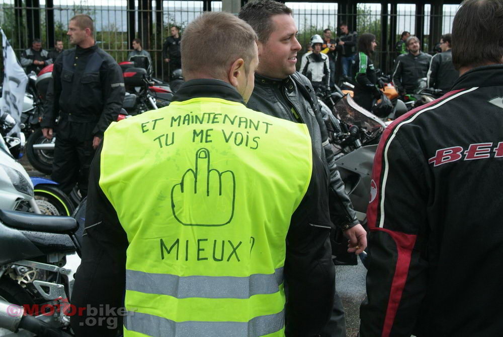 A French motorcyclists protests his government's 'high vis' vest laws in 2016
